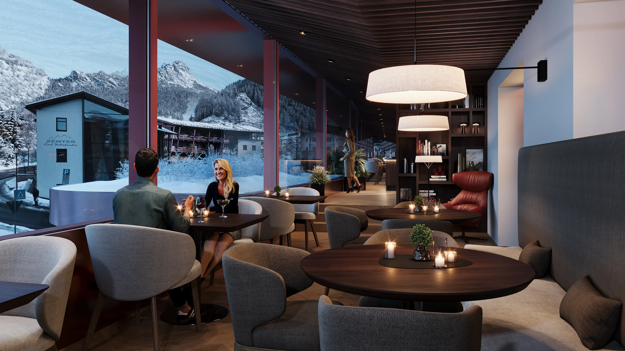Galleria lounge bar con tavoli e divani, perfetta per gustare un cocktail, con vista panoramica su Selva di Val Gardena.