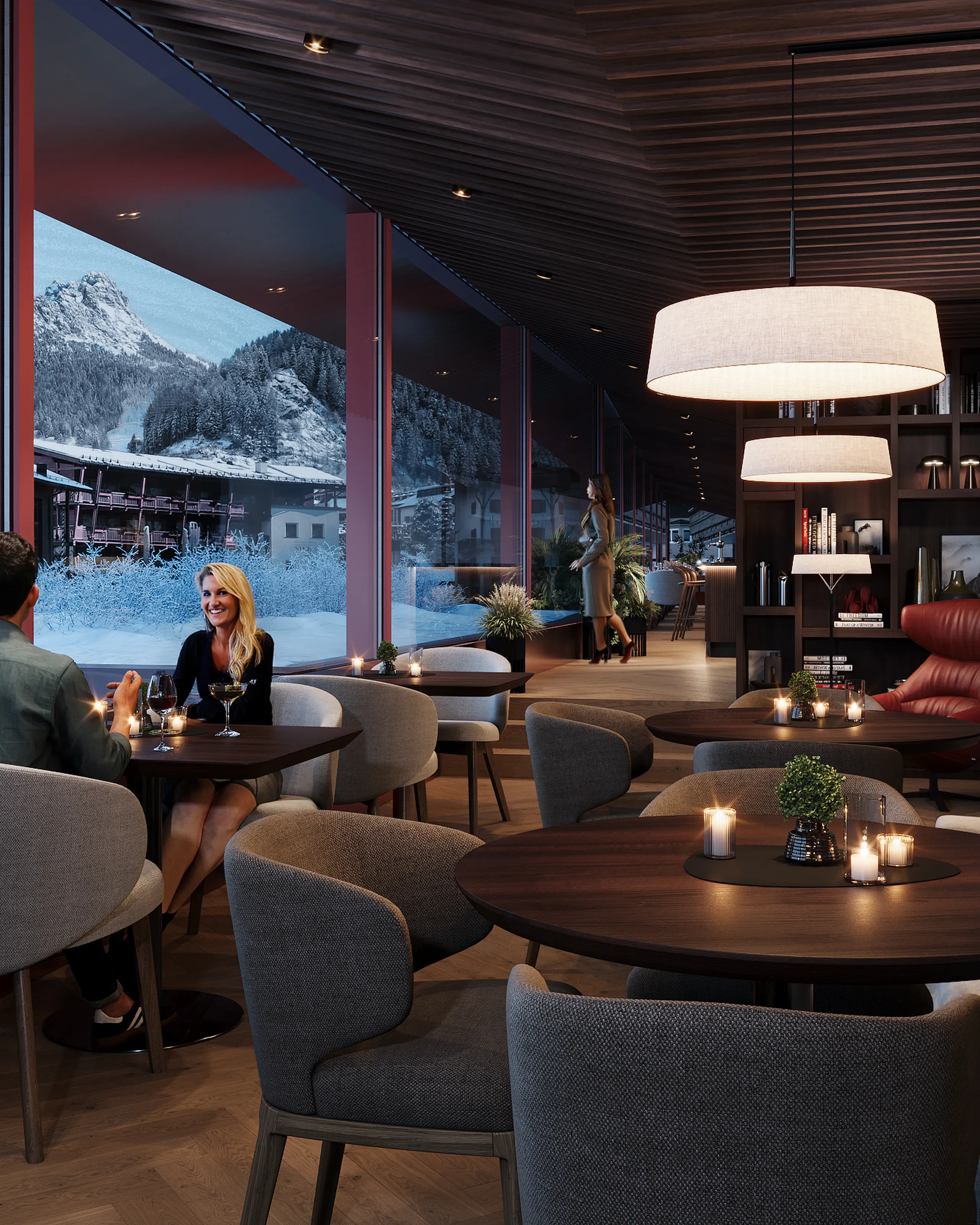 Galleria lounge bar con tavoli e divani, perfetta per gustare un cocktail, con vista panoramica su Selva di Val Gardena.