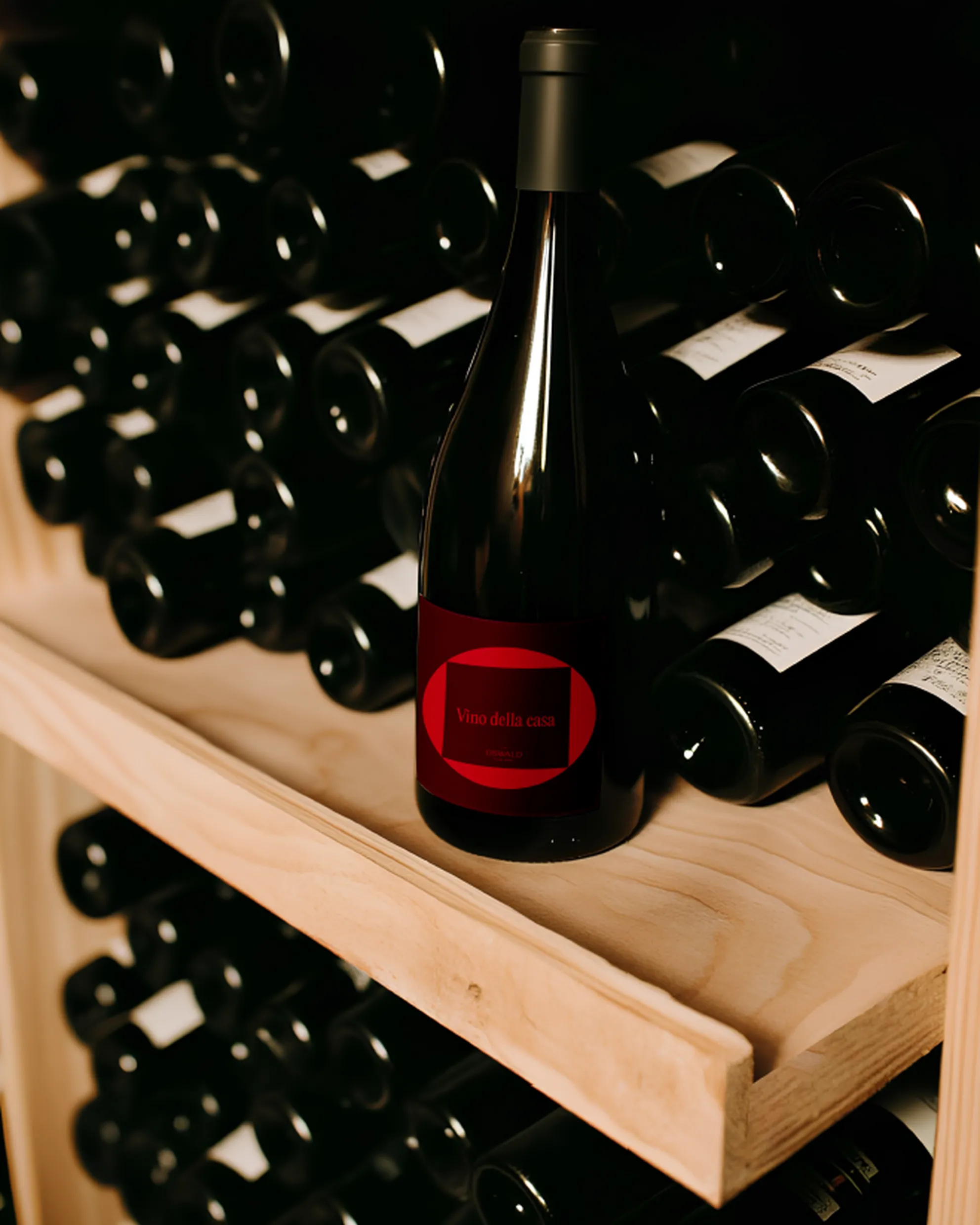 Wine cellar of Hotel Oswald with the house wine in the foreground.