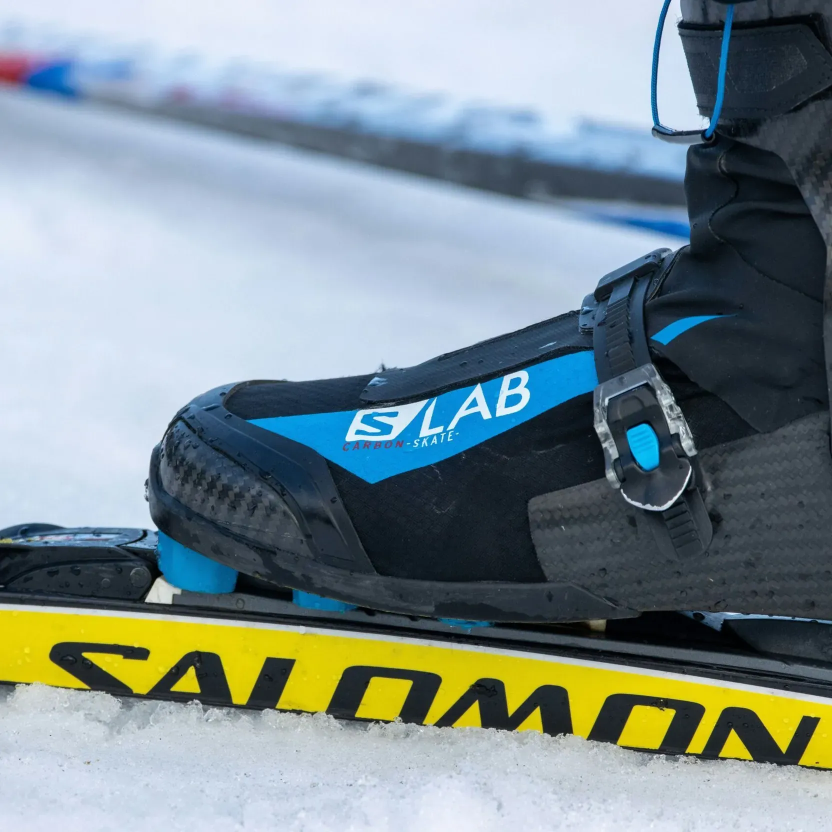 Close-up of a cross-country ski boot attached to a ski.